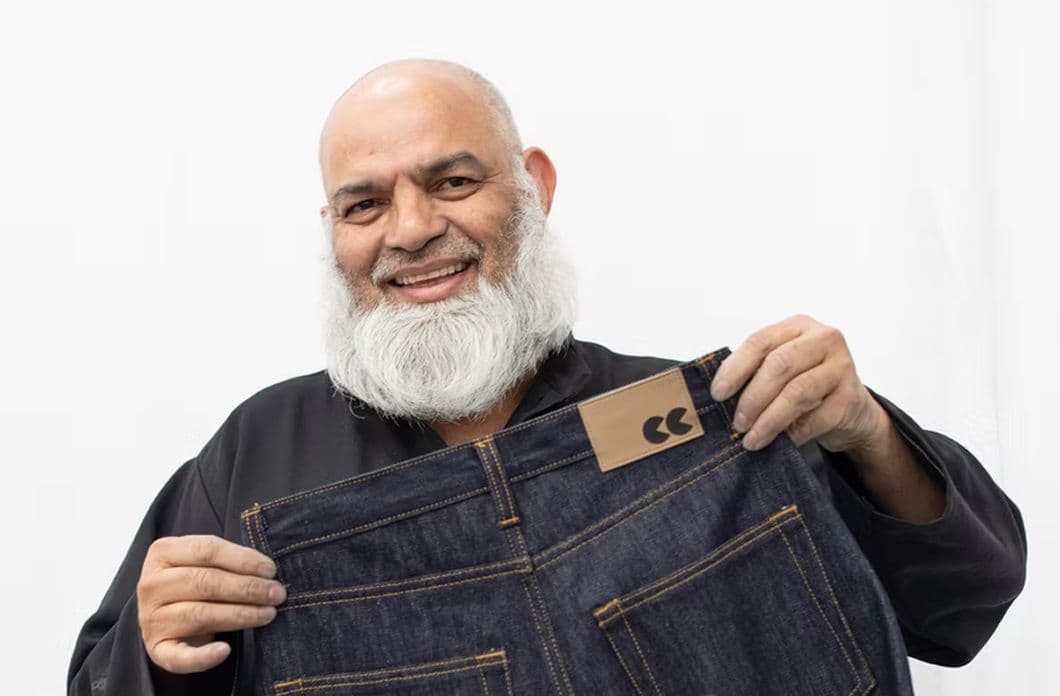 Man holding jeans